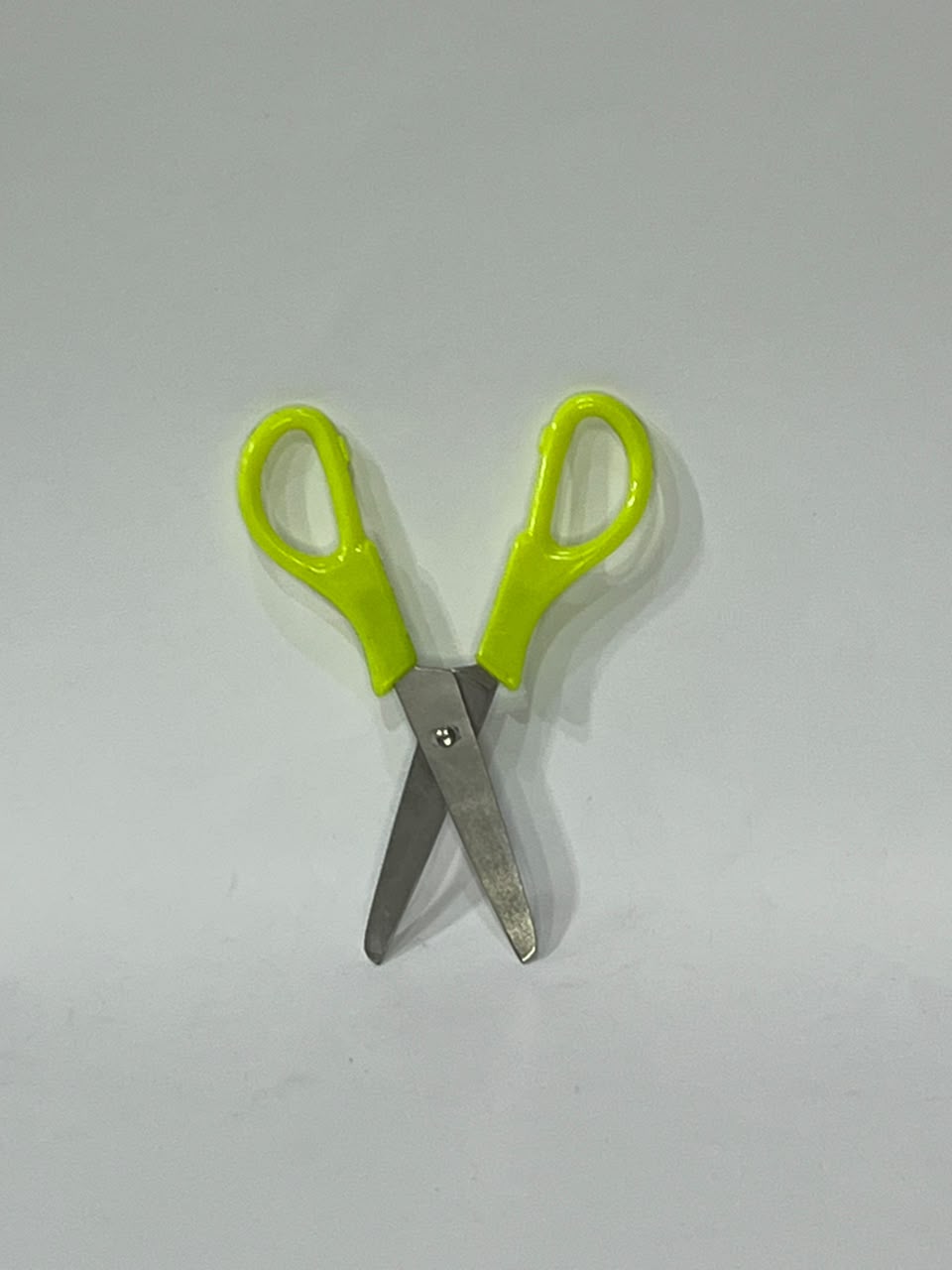Kids scissors with neon green handle