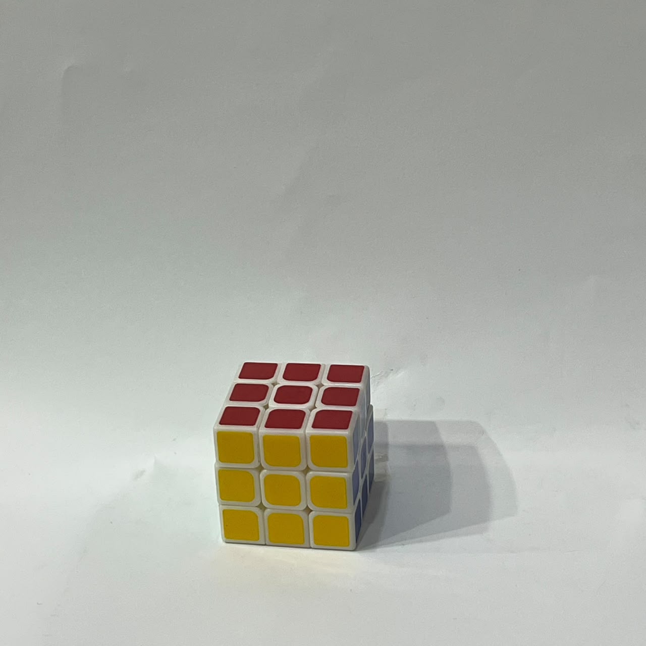 3x3 magic cube with orange and green tiles stacked